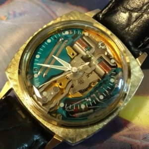 A watch with some parts missing on the side of it