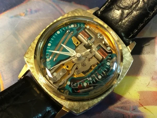 A watch with some parts missing on the side of it