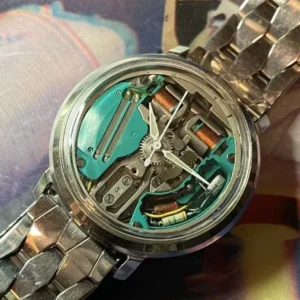 A watch with some parts missing and the back of it