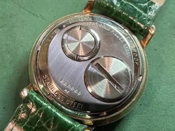 A close up of the back side of a watch