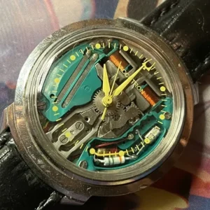 A watch with some parts missing on the side of it