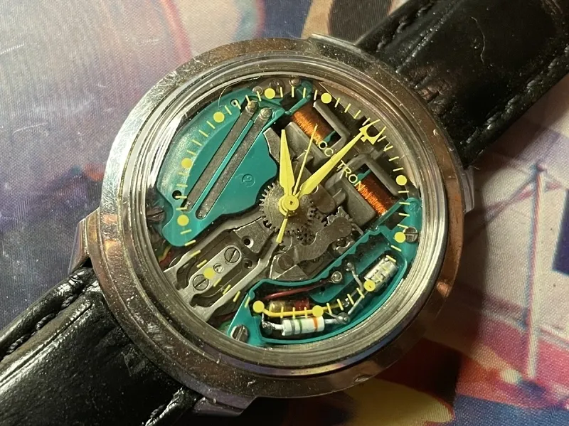 A watch with some parts missing on the side of it