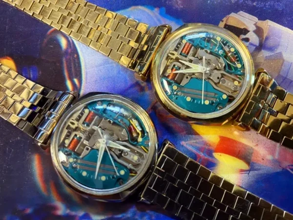 Two watches are shown on a colorful background.