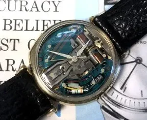 A watch with some parts missing on top of it