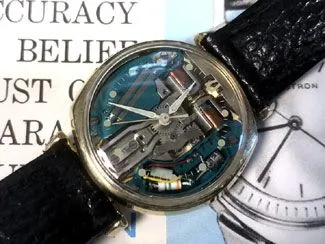 A watch with some parts missing on top of it