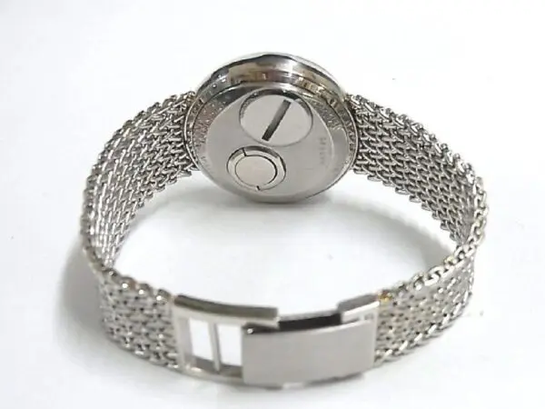 A silver watch with a metal chain band.