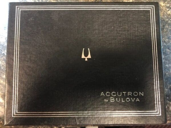 A black box with the logo of accutron by bulova.