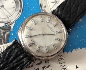 A watch is shown with diamonds on the face.