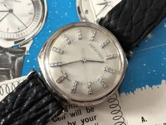 A watch is shown with diamonds on the face.