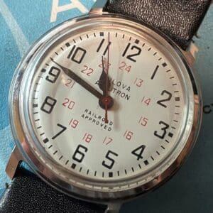 A close up of the face of an analog watch