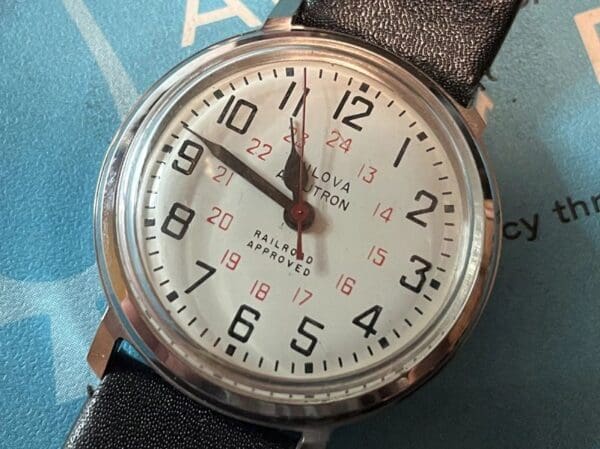 A close up of the face of an analog watch