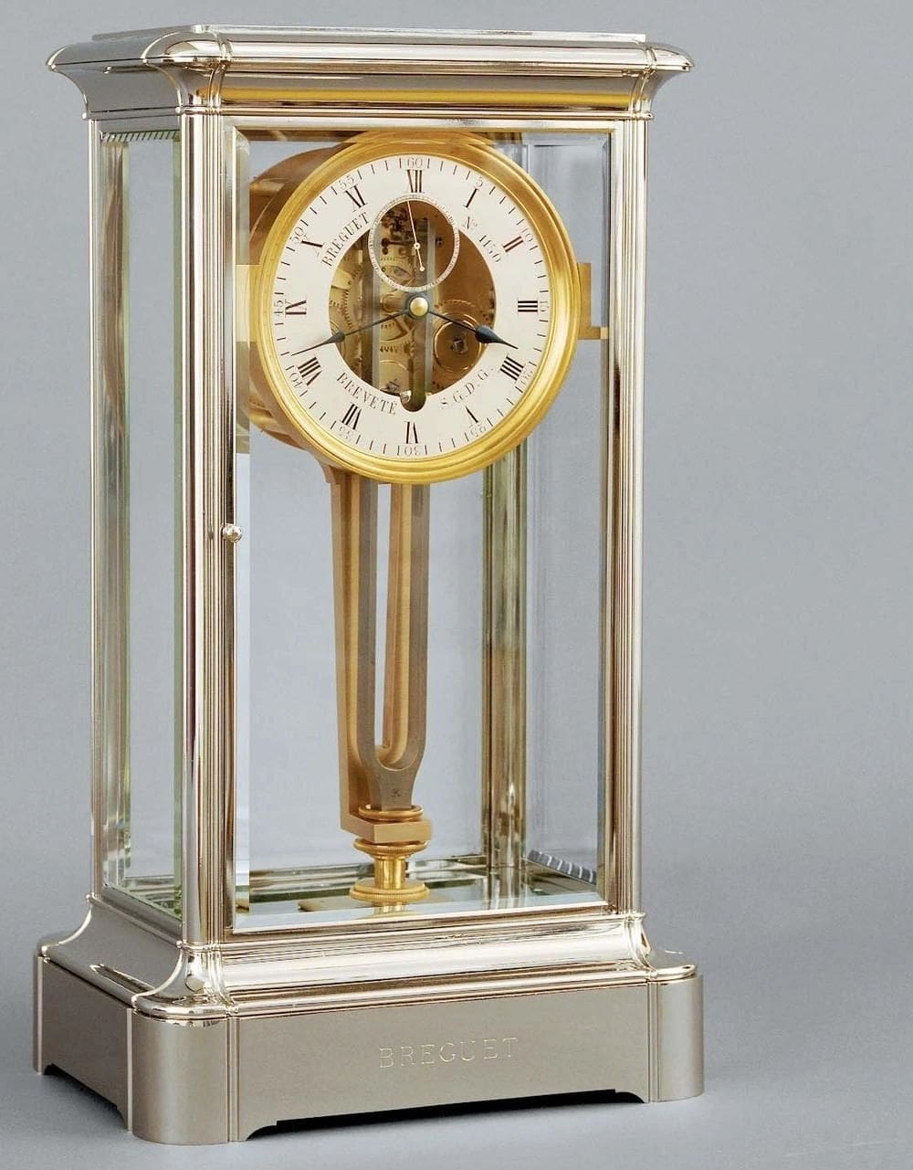 Gold Breguet clock with Roman numerals.