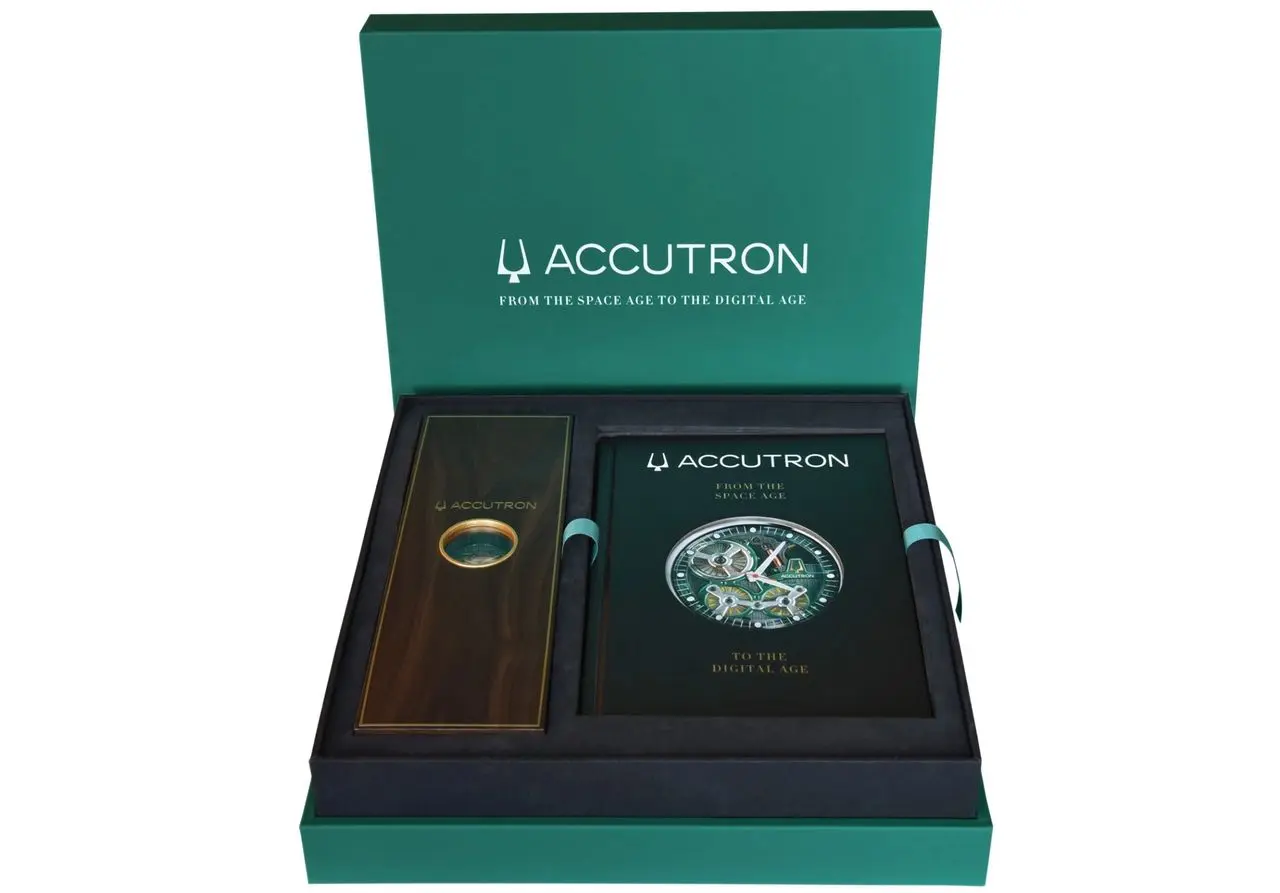 Accutron watch box with a book.