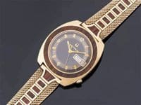 Gold wristwatch with brown wooden band.