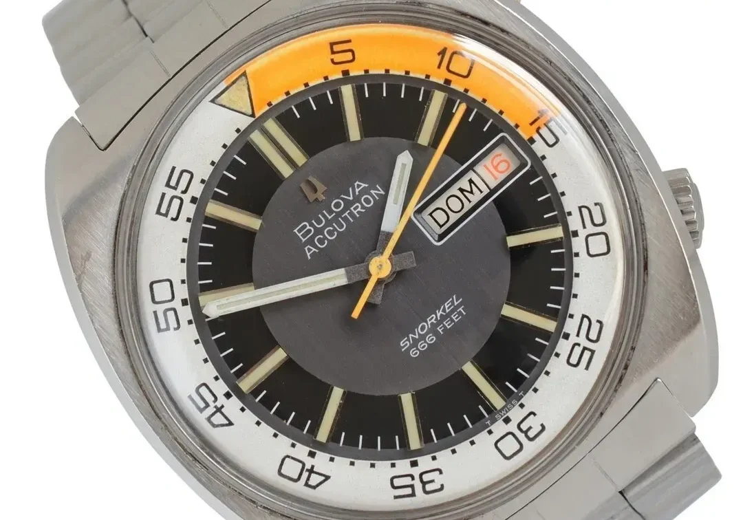 A watch with a yellow and black face