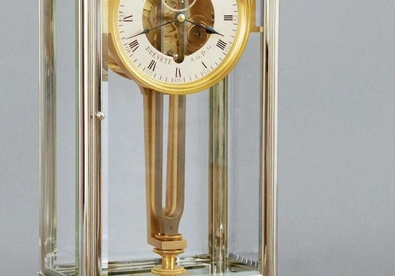 Gold Breguet clock with Roman numerals.