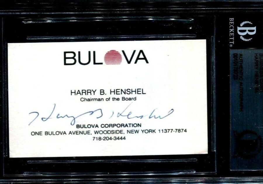 Bulova Corporation business card with signature.